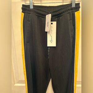 NWT nAna judy streetwear Iris Black Track Pant.Small. Gold side stripe. Zippers